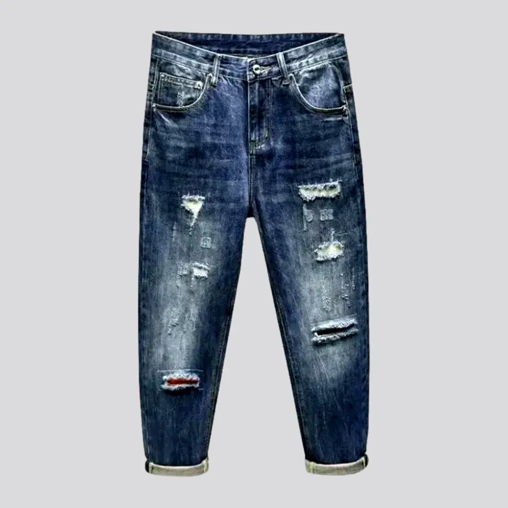 Medium-wash men's loose jeans