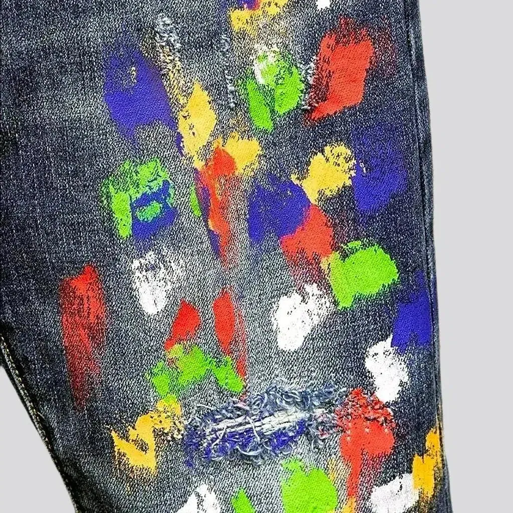 Multi-color stains sanded jeans