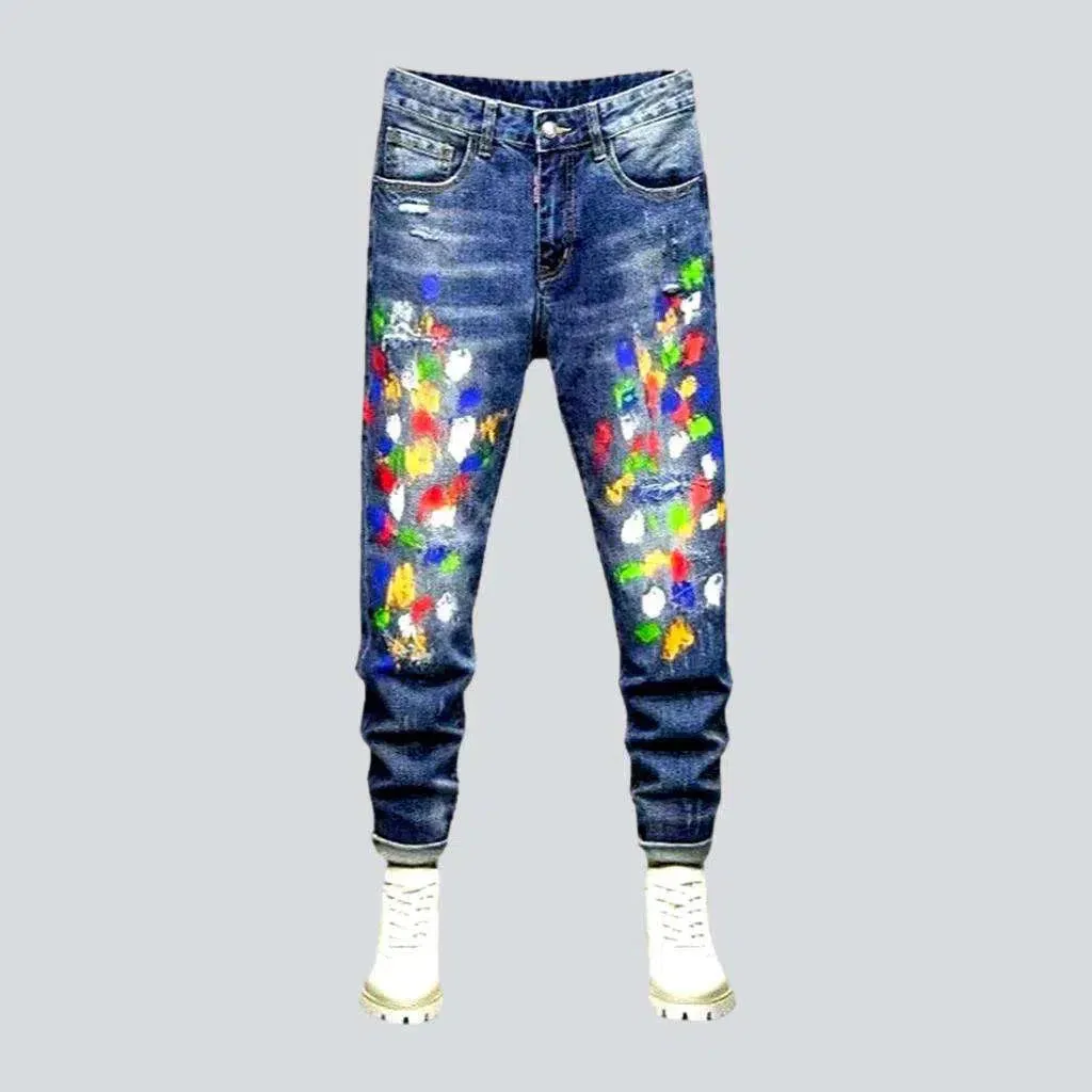 Multi-color stains sanded jeans