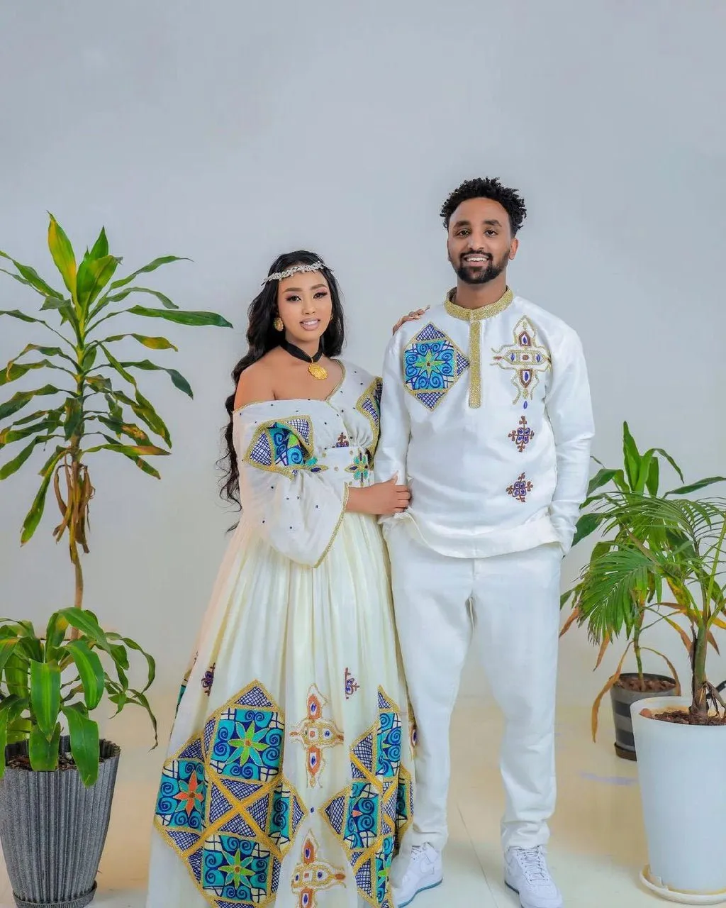 Sapphire Serenade: Ethereal Sparkle in Blue Habesha Couples Wedding Attire